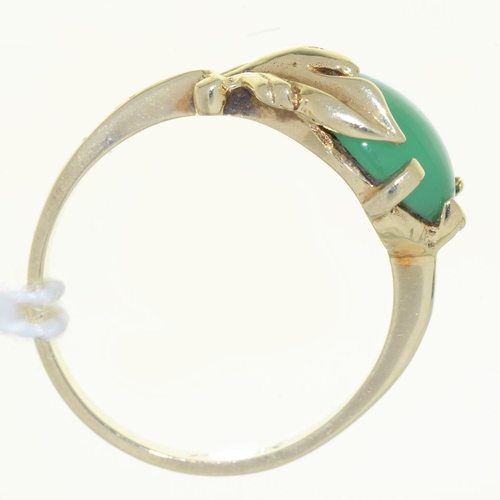 24 - A JADE RING, THE CABOCHON IN LEAFY SETTING,  IN GOLD MARKED 14K, 3.5G, SIZE P