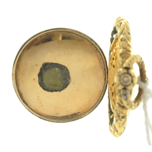 67 - A GOLD VINAIGRETTE, C1840 OF WATCH CASE FORM, THE GRILLE ENGRAVED AS A FLOWER IN A POT FLANKED BY FO... 