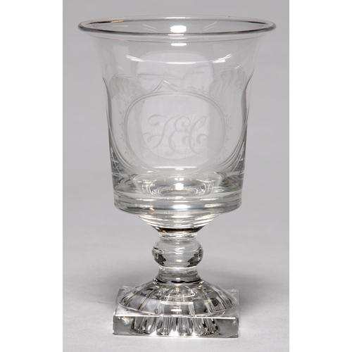 312 - AN ENGLISH GLASS RUMMER, C1800, THE FLARED BUCKET SHAPED BOWL ENGRAVED WITH INITIALS T E C IN AN OVA... 