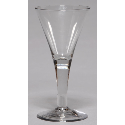 313 - AN ENGLISH GLASS GOBLET, C1770, THE FLARED BOWL ON SOLID STEM AND SPREADING FOOT WITH SHARP PONTIL S... 