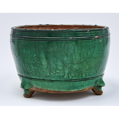 804 - A Chinese green glazed biscuit tripod censer, Ming dynasty, early 17th c, the rounded sides incised ... 