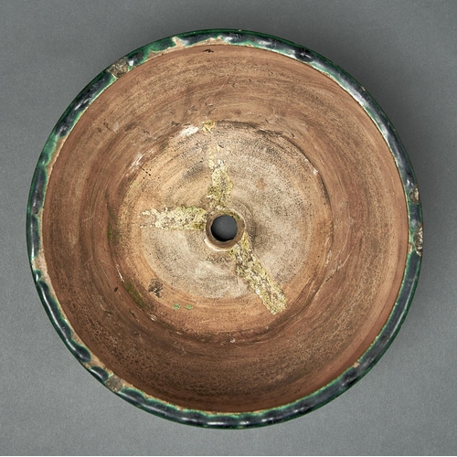 804 - A Chinese green glazed biscuit tripod censer, Ming dynasty, early 17th c, the rounded sides incised ... 