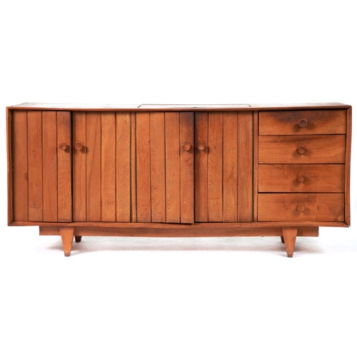 1465 - A mid century ash sideboard, c1960, the top with flush lidded central cutlery compartment with brass... 