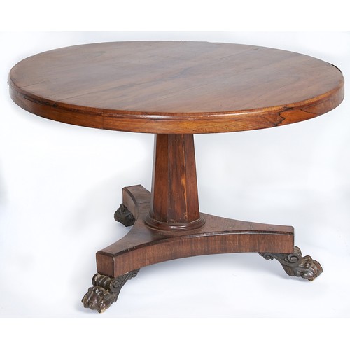 1556 - An early Victorian rosewood breakfast table, on tapered octagonal pillar, platform and carved paw fe... 