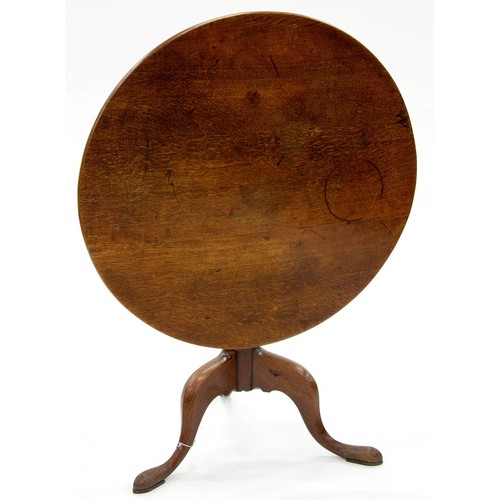 1541 - A George III oak tripod table, early 19th c, the round top on baluster pillar, 67cm h; 81cm diam... 