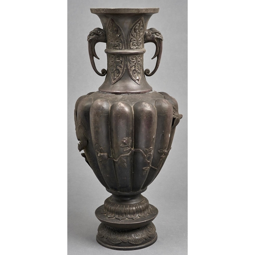 1046 - A Japanese bronze lobed oviform vase, Meiji period,  with elephant head handles, cast with lapets ap... 