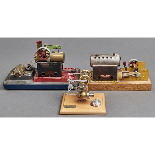 1073 - A Bohm Stirling model hot air engine, on varnished lightwood base, 12.5cm h and two Meccano statione... 