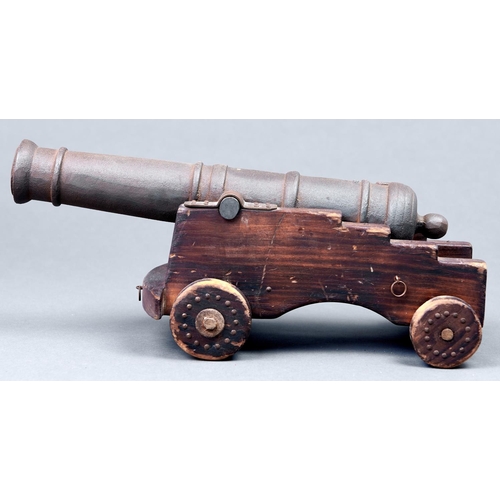 1080 - An iron model 1812 cannon on stained wood carriage, 20th c, barrel 36cm l