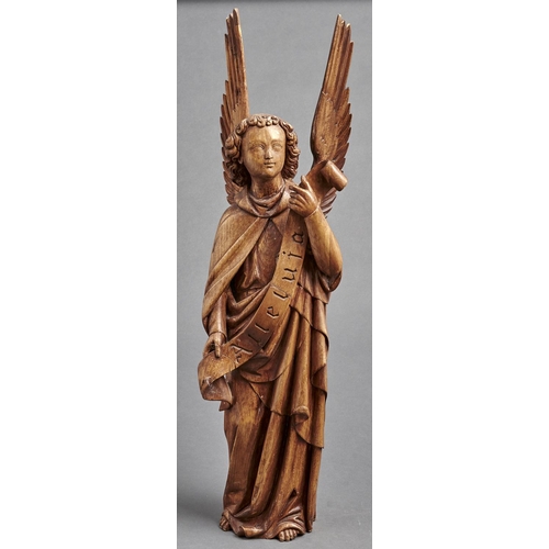 1102 - A carved walnut figure of an angel, 19th / 20th c, holding a banner inscribed Alleluia, 77cm h... 