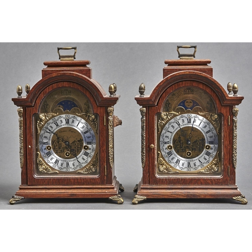 1133 - A pair of reproduction giltmetal mounted oak arch top bracket clocks, the silvered and brass dial wi... 