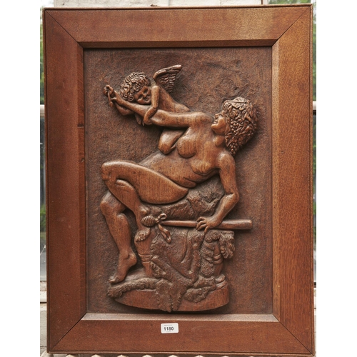 1180 - A carved oak bas relief panel, first half 20th c, of a bacchante and cupid, in oak frame, 75 x 58.5c... 