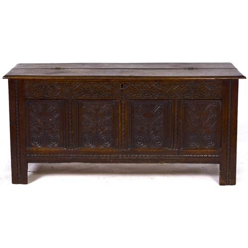 1485 - An 18th c carved and panelled oak blanket chest, 73cm h; 155 x 59cm