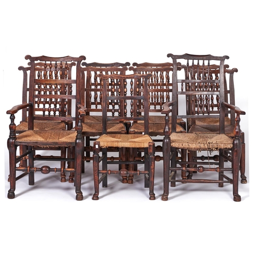 1494 - A set of eleven early Victorian rush seated ash spindle back dining chairs, including two elbow chai... 