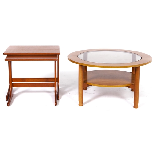 1496 - A Schreiber teak coffee table, c1970's, with inset glass centre, 44cm h x 85cm diam and a contempora... 