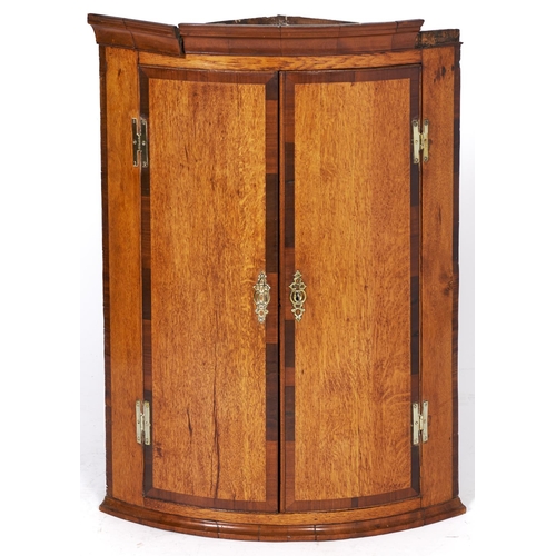 1501 - A George III inlaid oak bow fronted corner cupboard, 95cm h x 70cm w