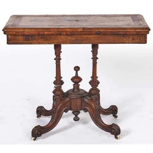 1525 - A Victorian inlaid walnut folding card table, with quarter veneered top, turned and carved pedestal ... 