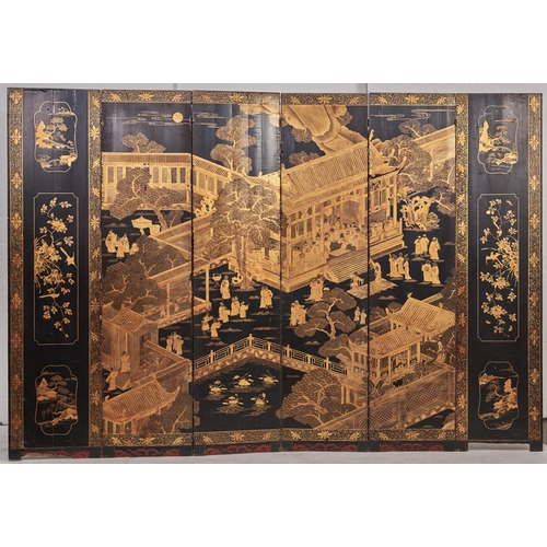 1549 - A Chinese gilt and black export lacquer six leaf screen, early 19th c, decorated with a palace compl... 