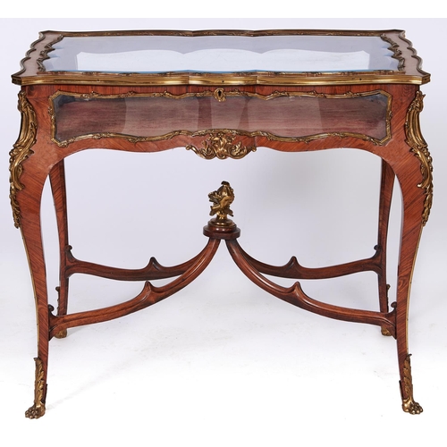 1550 - A French ormolu mounted kingwood display table, late 19th c, in Louis XV style, with bevelled glass ... 