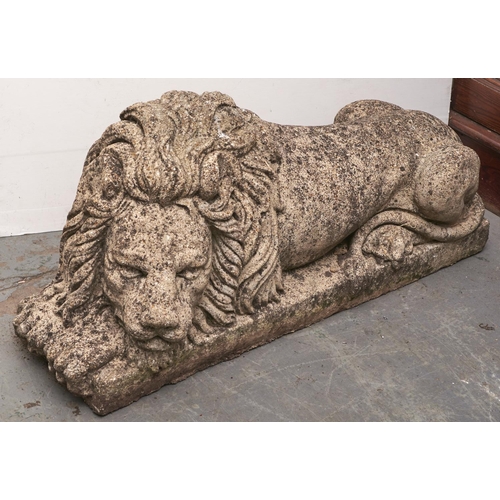 1569 - A pair of reconstituted stone lion garden ornaments, late 20th c, 110cm l approximately... 