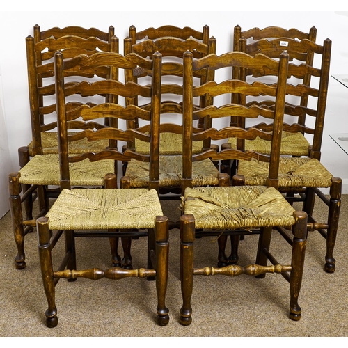 1573 - Eight stained ash ladder back chairs, early 20th c, rush seated, seat heights 45cm and circa... 