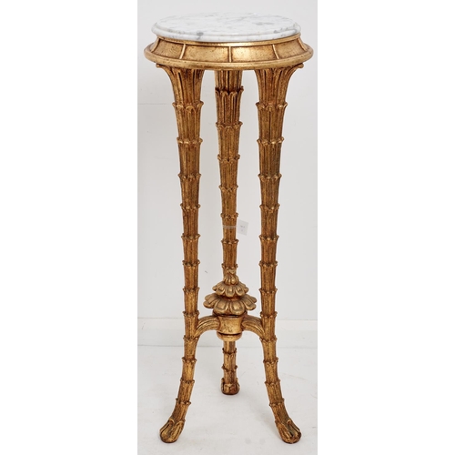 1582 - A reproduction gold painted tripod torchere, third quarter 20th c, the veined circular grey marble t... 