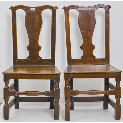 1594 - A pair of George III oak chairs, 18th c, with vase profile splat, boarded seat and turned stretcher,... 