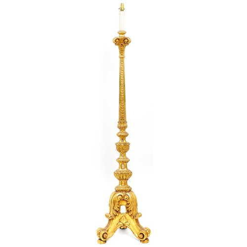 1604 - A Venetian giltwood standard lamp, 20th c, of alter candlestick form, inset with mirror glass, ... 