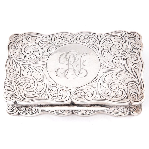 650a - An Edwardian silver snuff box, of scrolling outline with waisted sides and engraved with foliage, 75... 