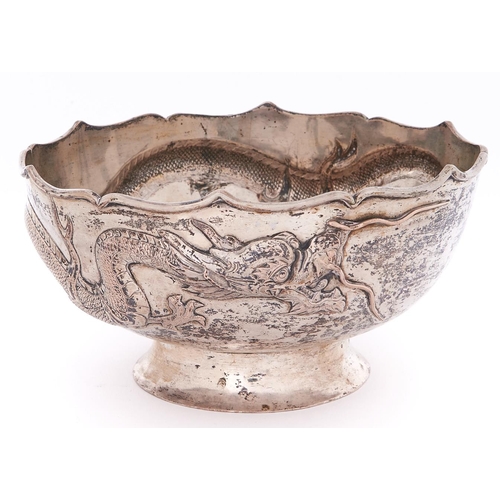 691 - A Chinese silver repousse dragon bowl, early 20th c, the dragon with applied silver wire whiskers on... 