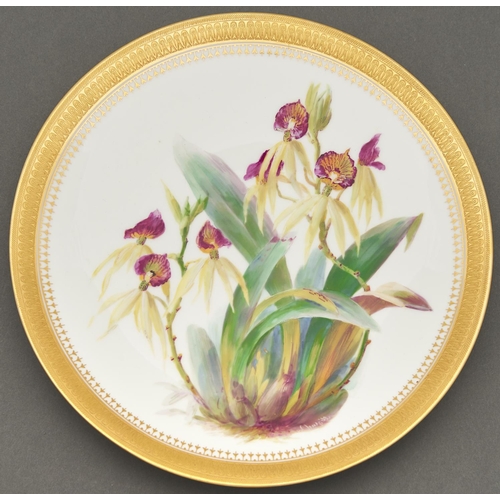 799 - A Minton bone china plate, 1879, painted by W Mussill, signed, with orchids, in etched gilt border, ... 