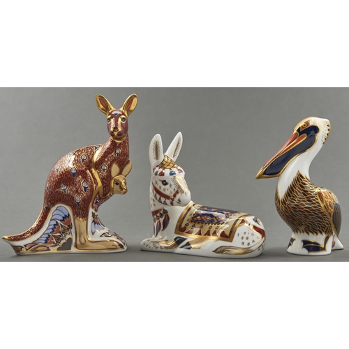 806 - Three Royal Crown Derby Pelican, Kangaroo and Donkey Foal paperweights, 15cm h and smaller, printed ... 