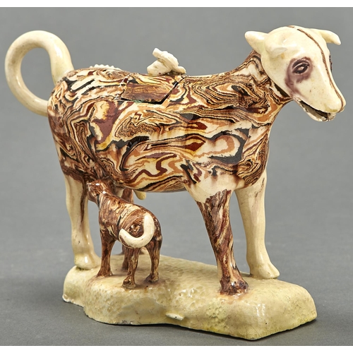 850 - A Staffordshire creamware cow creamer and cover, early 19th c, with marbled or agate glaze, the cove... 