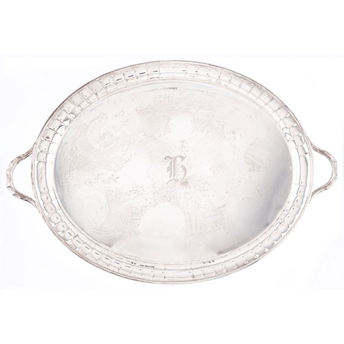 718 - A George V oval silver tea tray with fluted border, 71cm over handles by Stevenson & Law, Sheffi... 