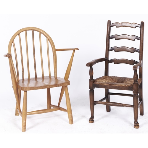 1504 - An Ercol child's armchair, with a child's rush seated ash ladder back armchair