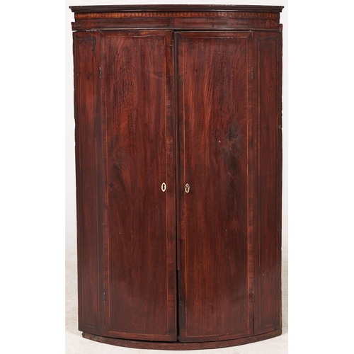 1532 - A George III bow fronted mahogany and line inlaid hanging corner cabinet, 69cm l... 