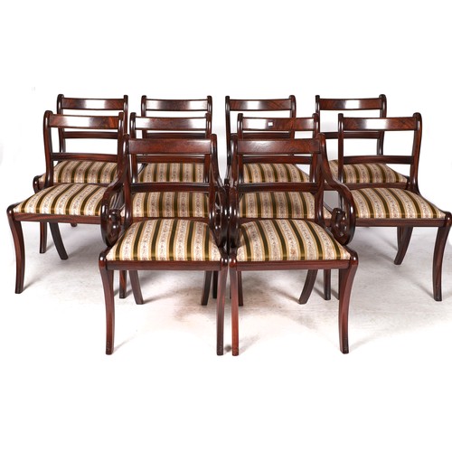 1538 - A set of ten Regency style mahogany dining chairs on sabre legs, green striped slip seats, seat heig... 