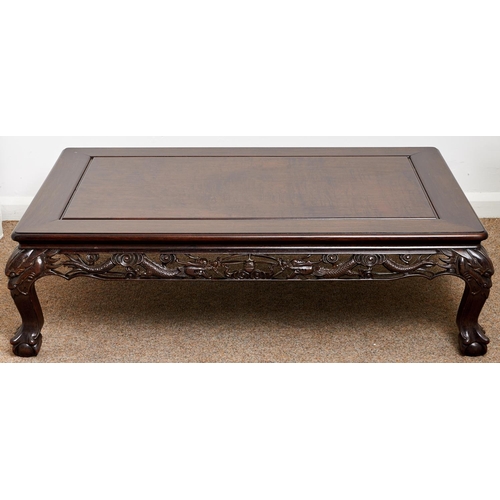 1548 - A Chinese hardwood low table, 20th c, with pierced and carved dragon frieze on zoomorphic legs, 35cm... 