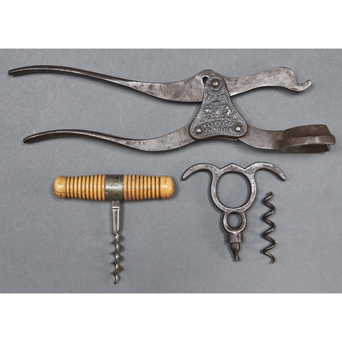 1003 - An English Lund's patent two piece lever corkscrew and a French roundlet or pocket corkscrew, with t... 