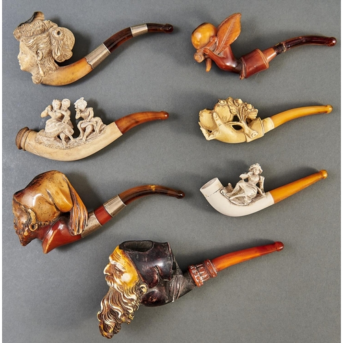 1031 - Three Meerschaum tobacco pipes, c1900, the bowl carved as the head of an elegant woman or bearded ma... 