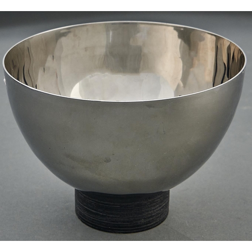 1038 - Vera Wang for Wedgwood. A polished stainless steel bowl on black painted wood foot, early 21st c, 11... 