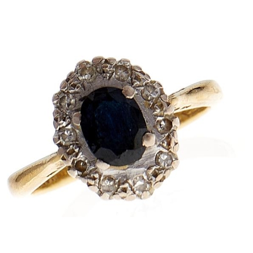 105 - A sapphire and diamond cluster ring, in 18ct gold, 2.9g, size G½
