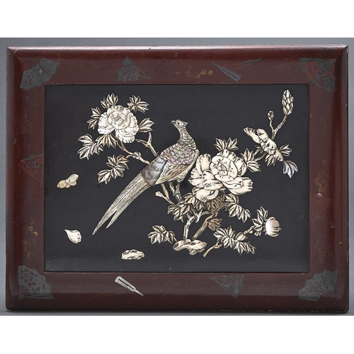 1053 - A Japanese carved bone, mother of pearl and lacquer panel of a peasant and flower, in red lacquer fr... 