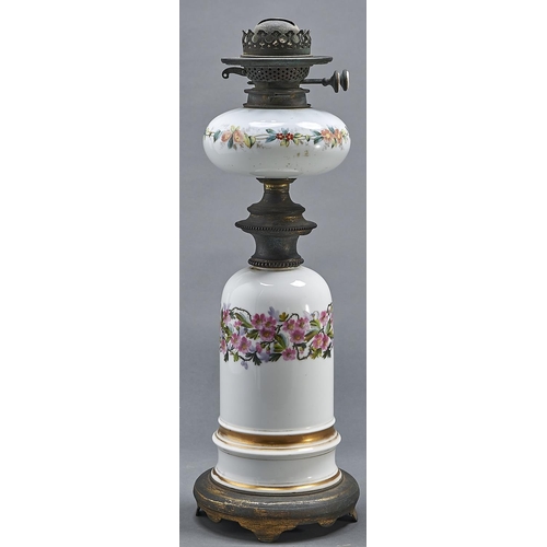 1074 - A French brass mounted porcelain oil lamp, late 19th c, the domed base painted with wild roses, the ... 