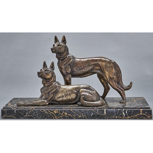 1077 - A French bronzed spelter sculpture of two German Shepherd dogs, c1930, on black and gold marble base... 