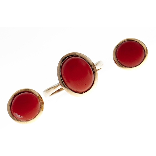 109 - A pair of coral ear studs and a similar ring, both in gold, 5.6g