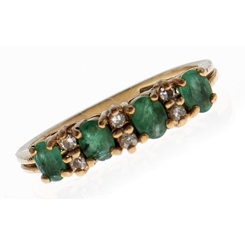 110 - An emerald and white stone ring, in 9ct gold, 2.1g, size L