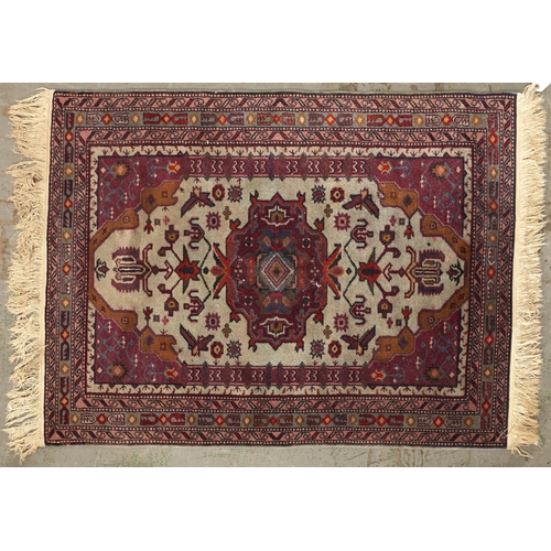 1454 - A modern Caucasian multi coloured bordered rug, the ale celadon ground worked to the centre with a g... 
