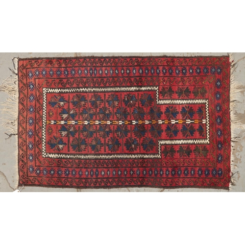 1456 - A Caucasian multi coloured border prayer rug, the geometric prayer arch filled with indigo and brown... 