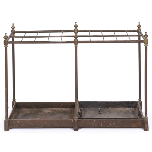 1475 - A tubular brass umbrella stand, on cast iron tray base, 62cm h; 29 x 89cm