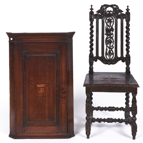 1476 - A George III oak hanging corner cupboard, c1770, with dentil moulded cornice, the panelled door inla... 